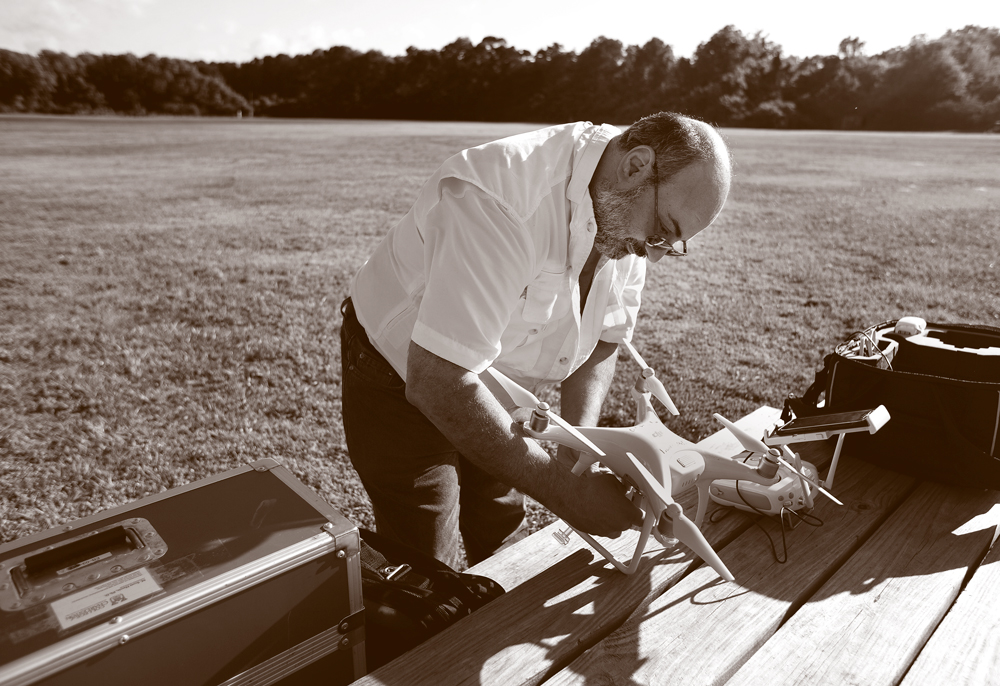 A man assembles a drone.