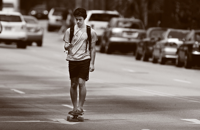 CH-Summer-2012-texting-skateboarder
